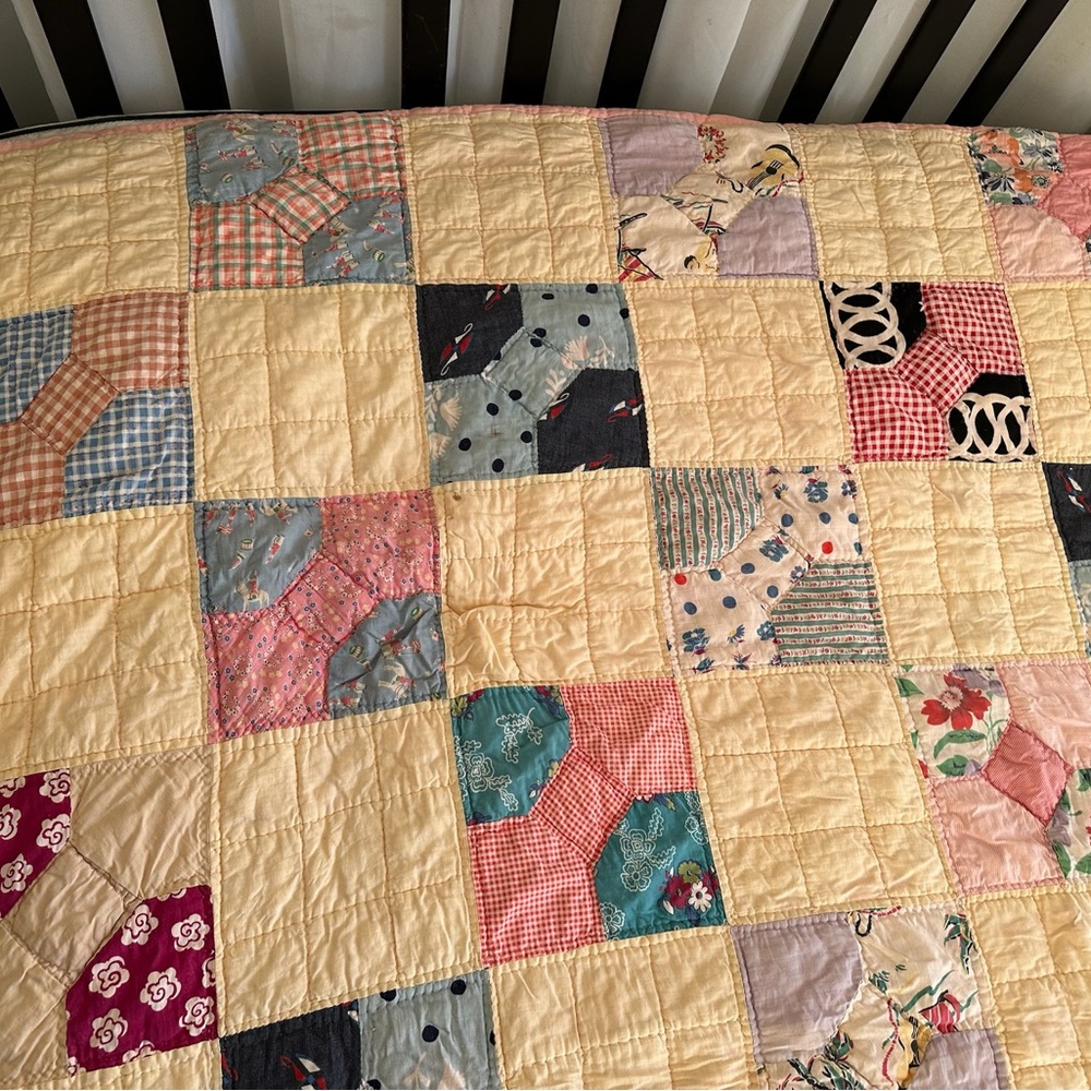 Antique yellow patchwork quilt